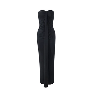 Detail showing the ruched texture and long vertical decorative strap on black tube dress