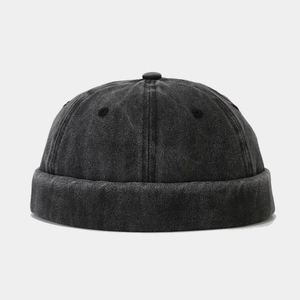 Detail of washed cotton docker hat showing vintage texture and breathable metal eyelets