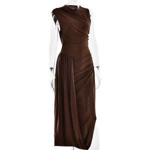 Detail of dark brown sleeveless maxi dress with elegant pleats and irregular split hem