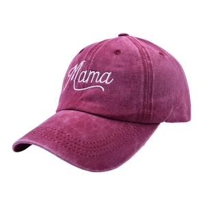 Close-up of Mama embroidery and washed vintage texture on burgundy baseball cap