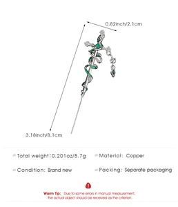 Detail view of a vintage sword hairpin with green snake accent and size measurements