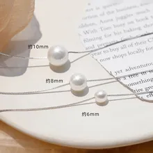 Detailed comparison of 6mm, 8mm, and 10mm white pearl necklaces on silver chains