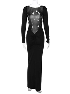 Detail view of backless V-shape design and gathered ruching on black slim-fit maxi dress