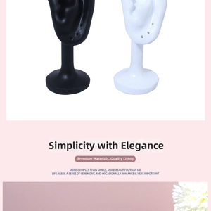 Pair of realistic silicone ear displays for earrings showing black and white models