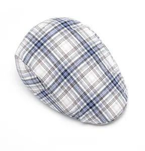Top view of blue and brown checkered flat cap showing detailed fabric pattern and stitching