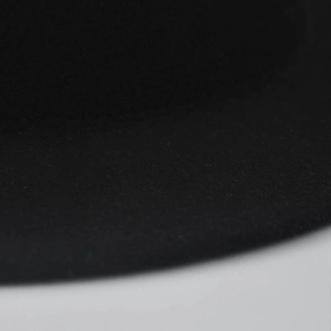Close-up detail of high-quality black wool felt material and neat stitching on hat brim