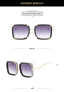 Detail of square oversized sunglasses with wavy metal temples and gradient lenses