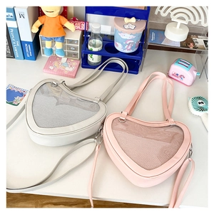 Detail of heart-shaped Itabags in white and pink with transparent display windows