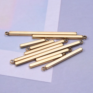 Detailed view of 11 pieces of golden stainless steel bar charms for jewelry making
