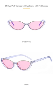 Detail view of transparent blue cat-eye sunglasses with pink lenses and metal trim