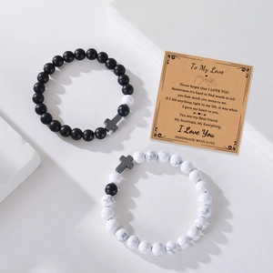 White turquoise and matte stone couple bracelets with cross charms on greeting card