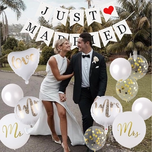 Wedding decor set featuring JUST MARRIED banner and gold-lettered Mr Mrs latex balloons