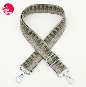 Close-up of ethnic geometric jacquard weaving strap with polished silver metal swivel hooks