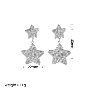 Silver retro textured star dangle earrings, 40x22mm size and 11g weight on white background