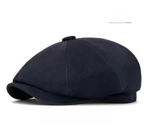 Detailed view of navy newsboy cap showing brushed fabric texture and 6-panel structure