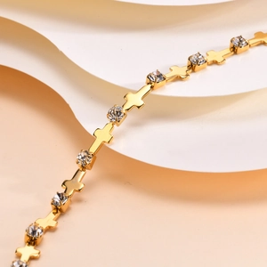 Detail of 18K gold-plated bracelet with cross charms and sparkling zircon stones