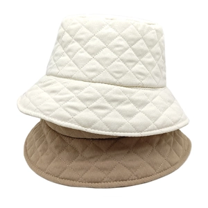 Padded diamond quilted bucket hats in beige and khaki colors for winter warmth