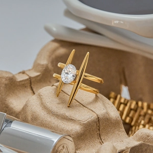 Macro view of a 18K gold plated stainless steel ring with oval zircon and double-layer band