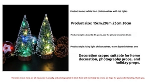 Mini frosted LED Christmas tree detail with wooden base and glowing fairy lights