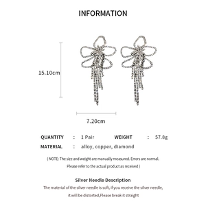 Detailed view of rhinestone flower earrings with long tassels and precise dimensions