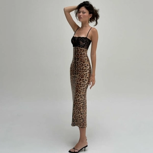 Detail of leopard print midi dress featuring black lace patchwork and slit hem design