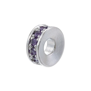 Macro shot of silver plated round wheel charm bead set with purple cubic zirconia stones