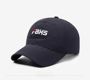 Detail view of navy baseball cap featuring 3D rBXS embroidery and quick-dry fabric