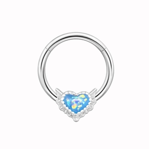 Detailed close-up of a silver nose ring featuring a heart-shaped blue opal stone inlay