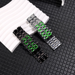 Lava LED metal electronic watches in black and silver on white wave display base