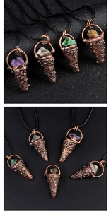 Detail view of colorful cone-shaped crystal pendants wrapped in vintage bronze wire