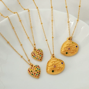 Elegant gold necklaces with heart and oval pendants encrusted with vibrant colorful rhinestones