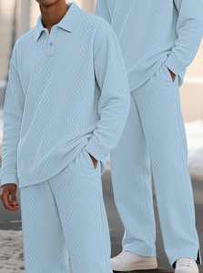Detail of light blue men's polo set featuring vintage textured diamond knit patterns