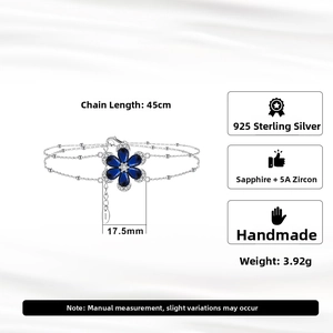 Detail of S925 silver double-layer bracelet with a 17.5mm blue zircon flower charm