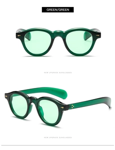 Detail view of retro round green frame sunglasses with metal hinges and ocean lenses