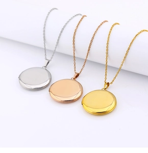Three polished heart-shaped locket necklaces in silver, gold, and rose gold finishes