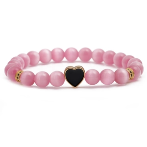 Pink cat eye stone beaded bracelet with black heart pendant and gold stone spacers