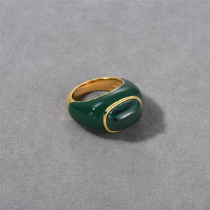 Detailed macro view of 18k gold plated ring with green enamel and natural malachite stone