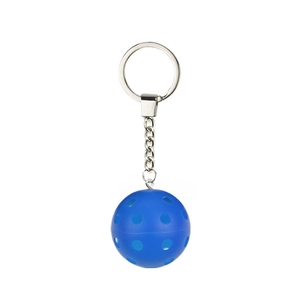 Detailed view of blue perforated pickleball keychain with silver metal ring and chain