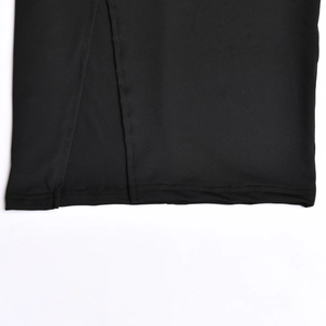 Detailed macro view of the black knitted high waist skirt featuring a side slit design