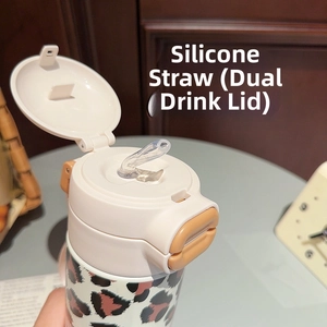 Detail of leopard print tumbler with dual-drink lid and silicone straw nozzle