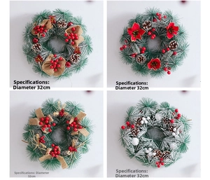 Detail showing four 32cm Christmas pine wreaths with berries, cones and faux snow
