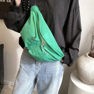 Minimalist vibrant green nylon crossbody chest bag with adjustable wide strap for women