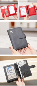 Detail of RFID passport holder interior with card slots, SIM slot and gold plane icon