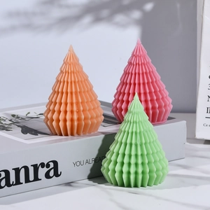 Minimalist Christmas tree scented candles with elegant geometric pleats in vibrant colors