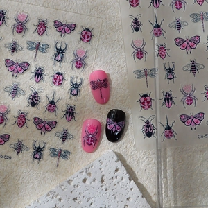 Macro shot of 5D pink insect nail art stickers with butterfly and bee patterns Co-529