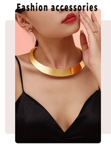 Macro shot of polished gold wide choker necklace on a model with glossy mirror finish