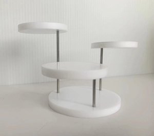Detailed four-tier white acrylic display stand with silver metal poles for jewelry and rings