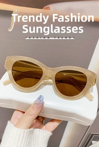 Cat eye sunglasses in beige resin frame with dark brown lenses and white travel case