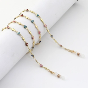 Golden eyewear chain featuring colorful evil eye beads and metal star charms