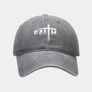 Detail of washed grey denim baseball cap with white FAITH cross print on the front
